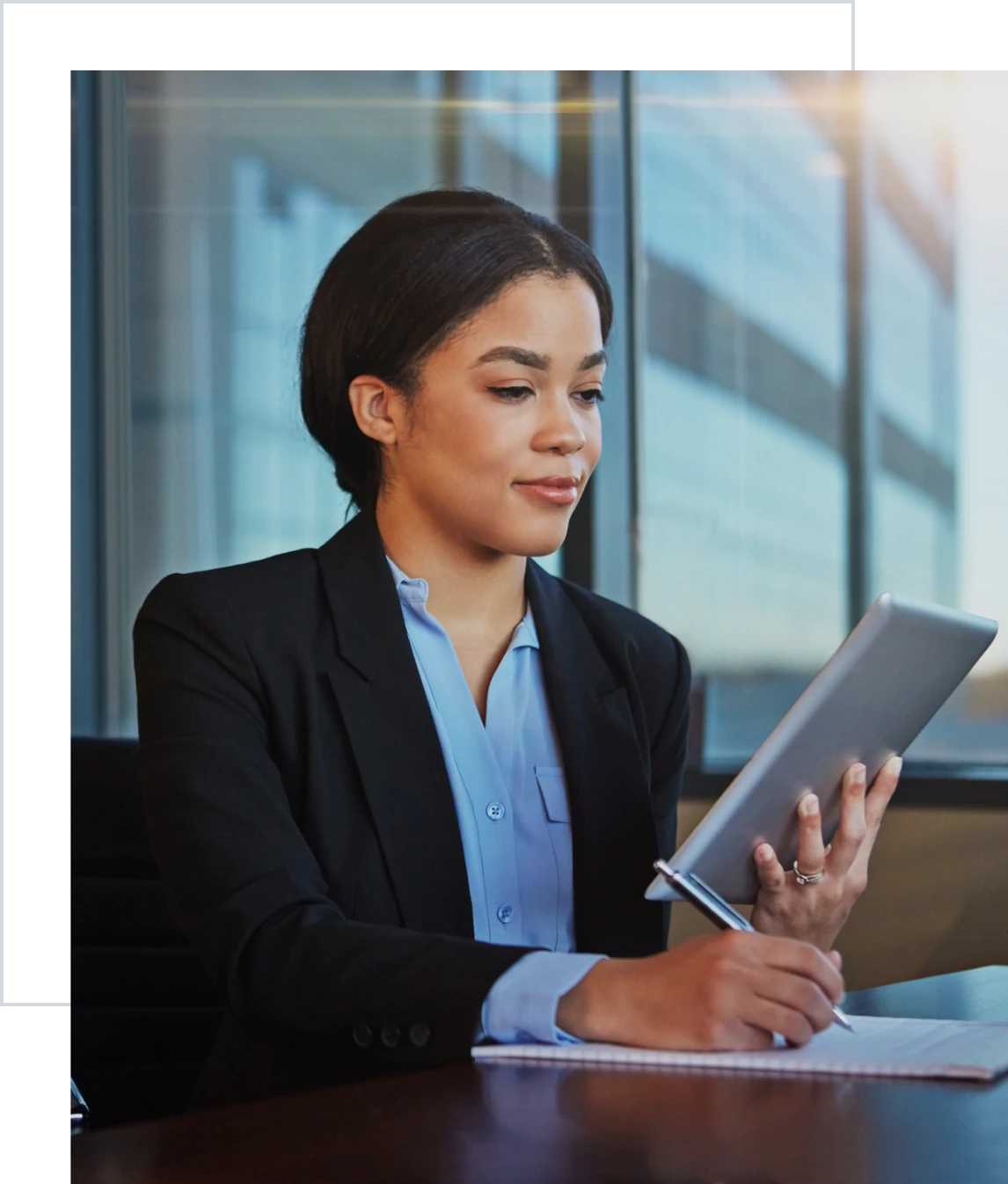 Confident executive working on tablet