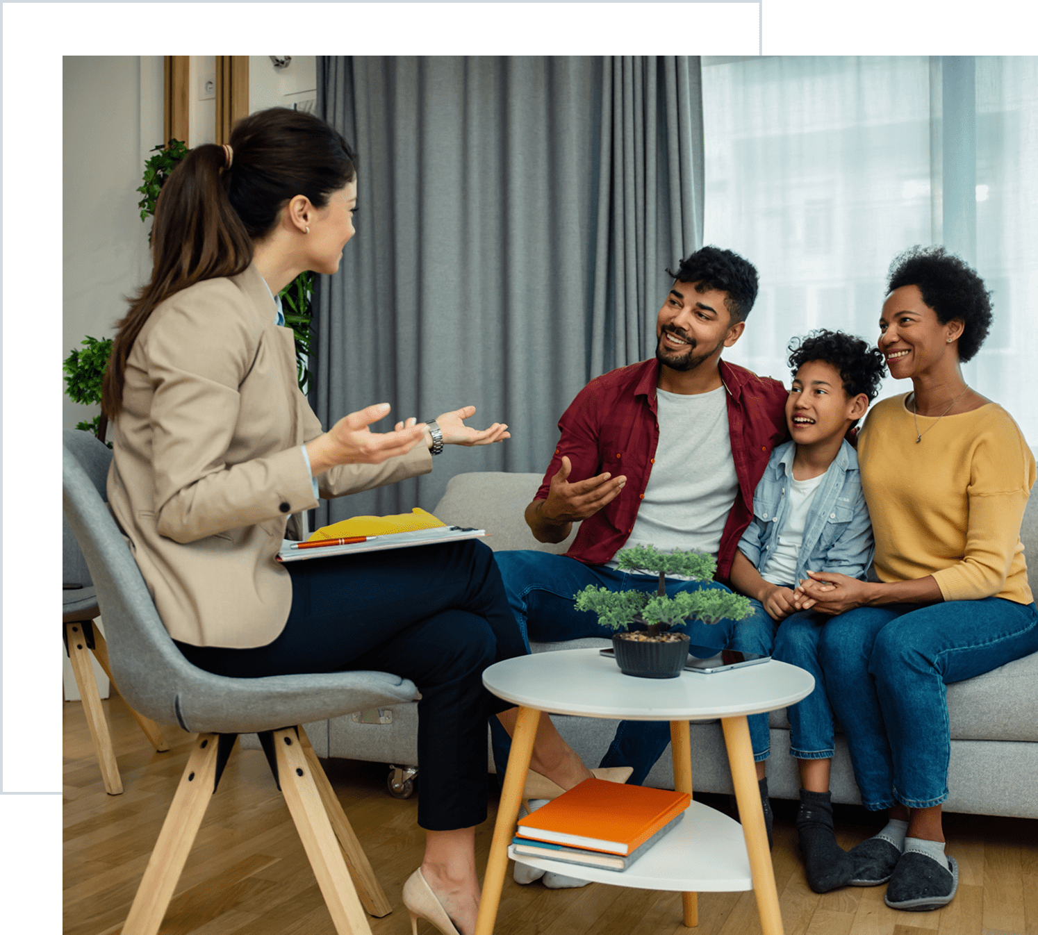 Woman talking to a smiling family