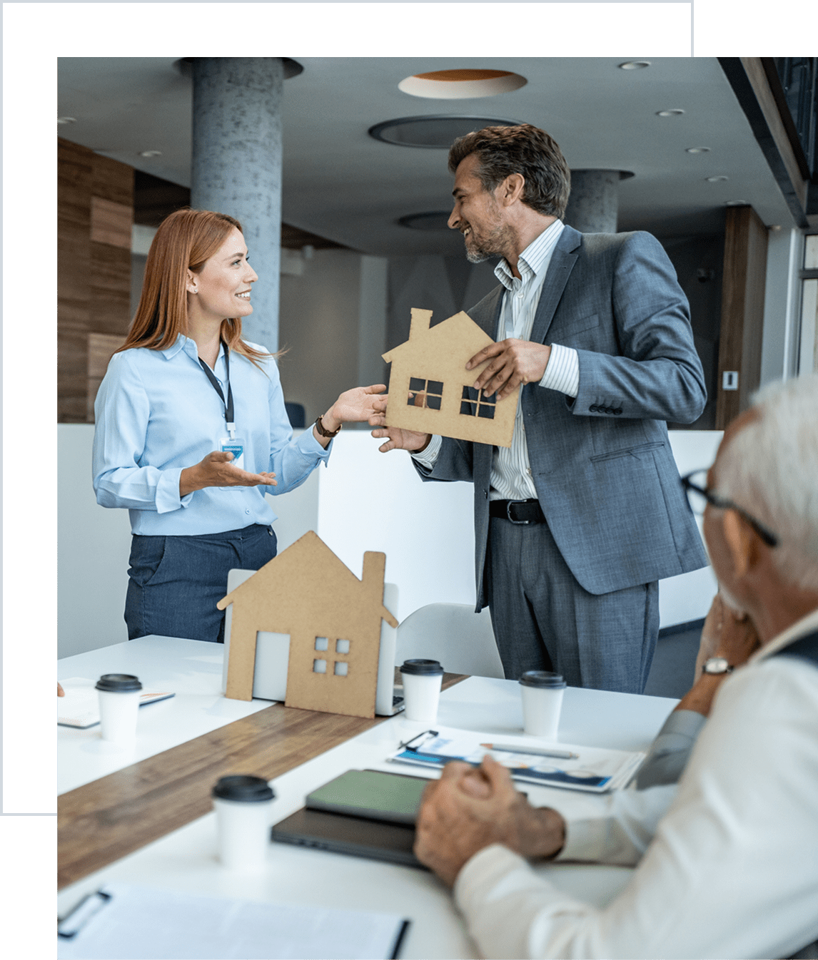 Business meeting with house models